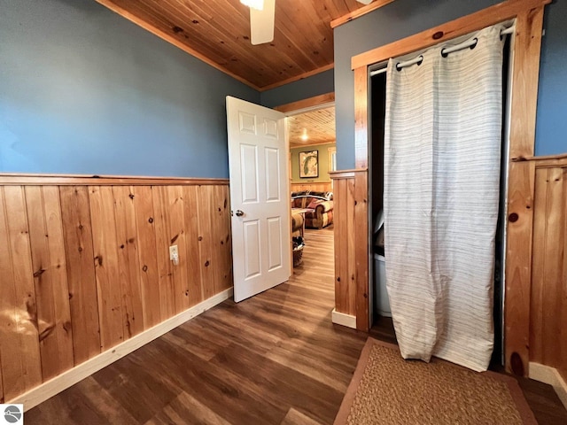 160 White Birch Ln, Cadillac, MI 49601 - hall featuring a wainscoted wall, wood finished floors, wooden walls, and wood ceiling