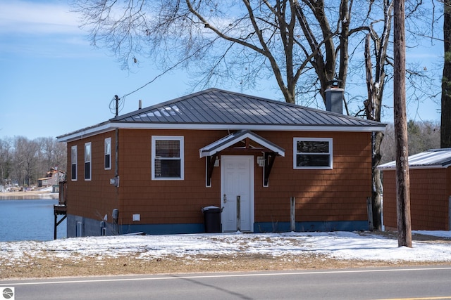 9701 S Lake Station Ave, Lake, MI 48632 - view of front facade featuring a chimney and metal roof