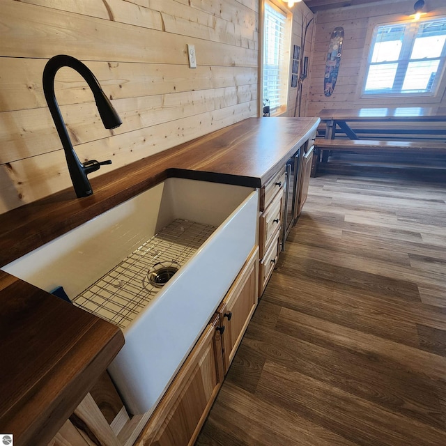 9701 S Lake Station Ave, Lake, MI 48632 - kitchen featuring butcher block countertops, wooden walls, and dark wood finished floors