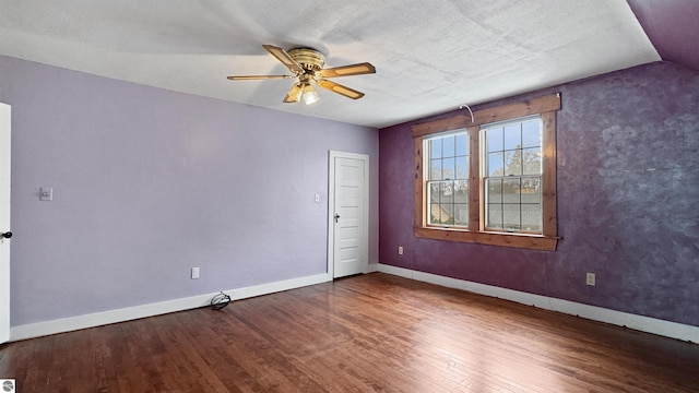 unfurnished room with baseboards, ceiling fan, and wood finished floors
