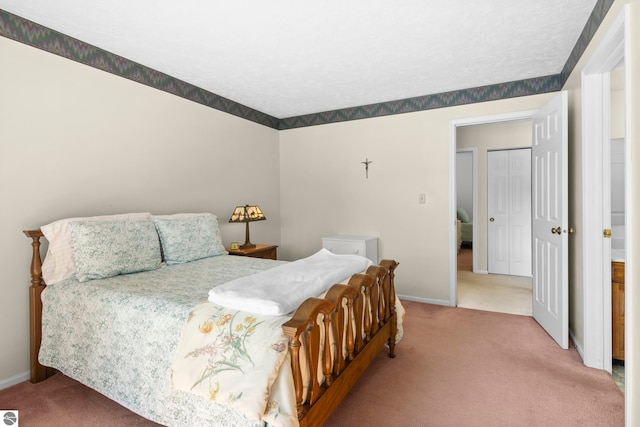 carpeted bedroom with baseboards