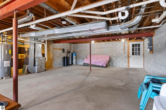 unfinished basement with heating unit and electric water heater