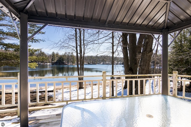 wooden terrace featuring a water view