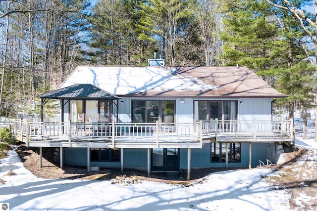 back of house with a wooden deck