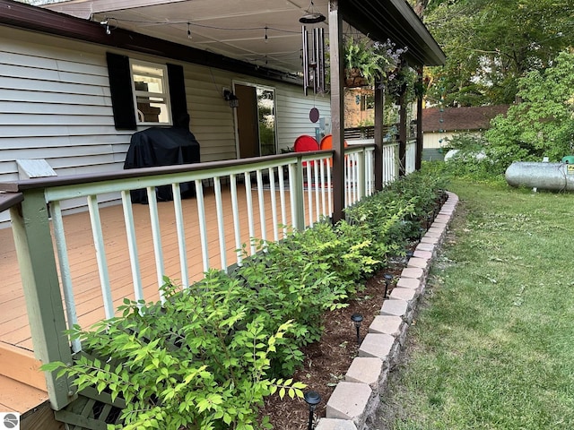 view of side of home with a yard