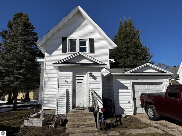 131 E State, Mancelona, MI 49659 - traditional-style house featuring an attached garage and entry steps