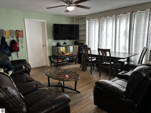 131 E State, Mancelona, MI 49659 - living area featuring wood finished floors and ceiling fan
