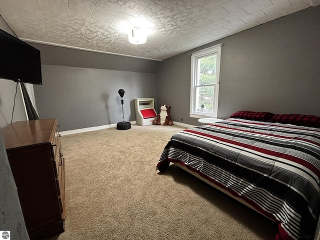131 E State, Mancelona, MI 49659 - carpeted bedroom with baseboards and vaulted ceiling