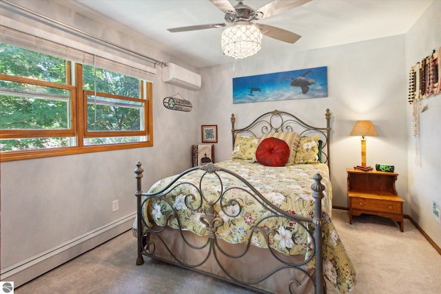 carpeted bedroom with a baseboard radiator, a wall unit AC, baseboards, and a ceiling fan