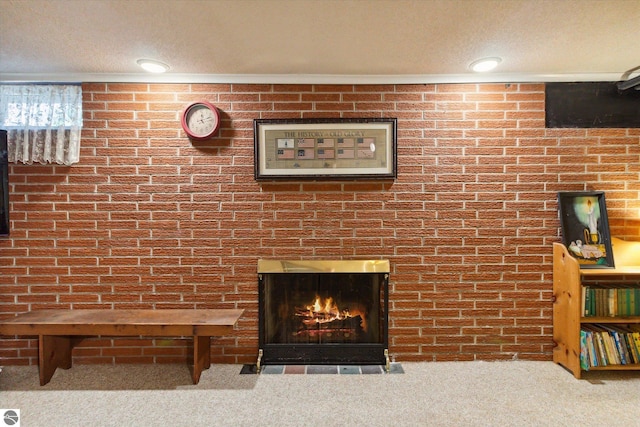 interior details featuring carpet flooring, a warm lit fireplace, and a textured ceiling