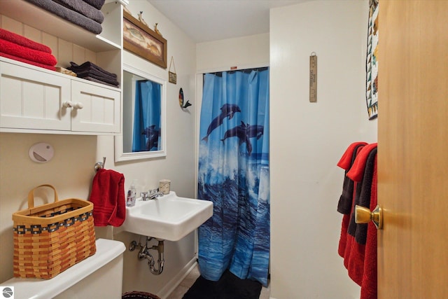bathroom with a sink and a shower with curtain