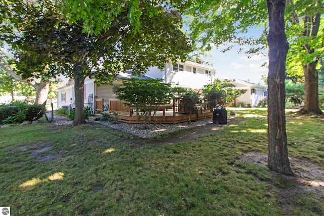 view of yard with fence and a wooden deck