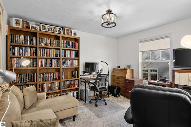 home office featuring a chandelier