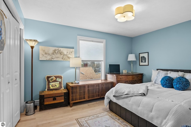 bedroom with wood finished floors