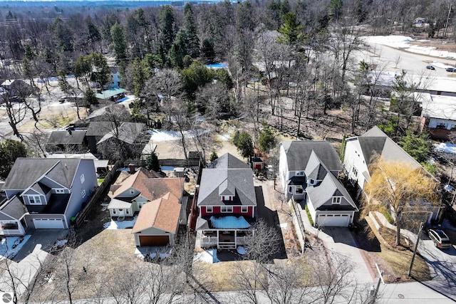 aerial view of residential area with a heavily wooded area