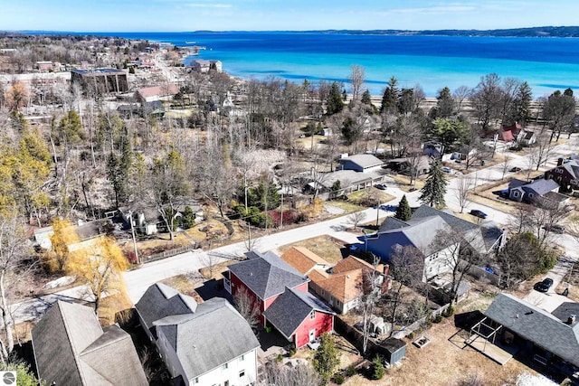 aerial perspective of suburban area with a nearby body of water
