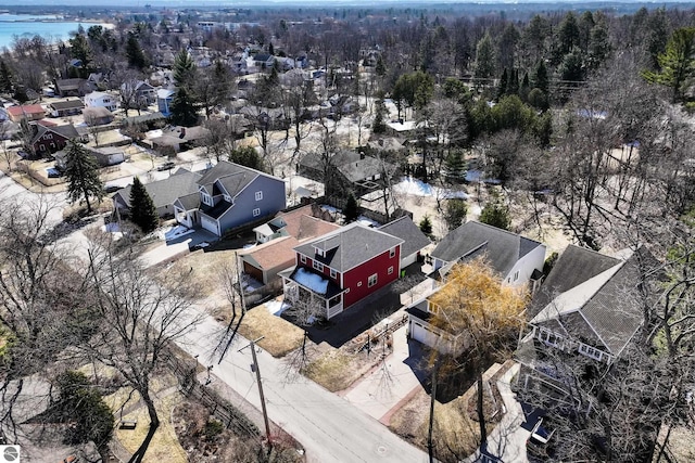 aerial view of residential area featuring a heavily wooded area