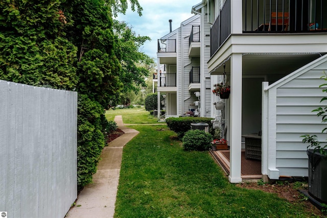 750 Centre Pl Unit 5, Traverse City, MI 49686 - view of green lawn featuring a balcony