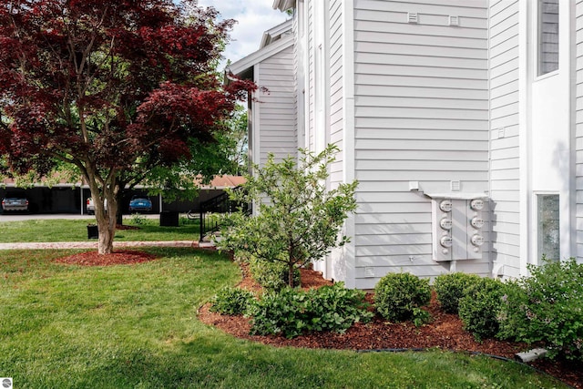 750 Centre Pl Unit 5, Traverse City, MI 49686 - view of side of property featuring a lawn