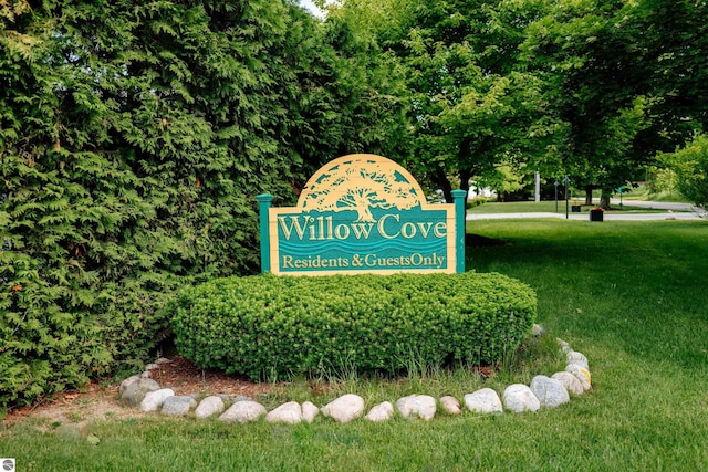 750 Centre Pl Unit 5, Traverse City, MI 49686 - community sign with a lawn