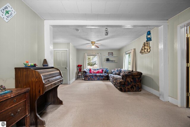 interior space with baseboards and ceiling fan