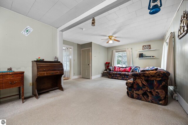 interior space with baseboards and ceiling fan
