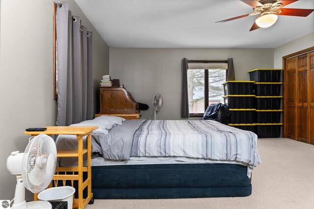 carpeted bedroom featuring a ceiling fan