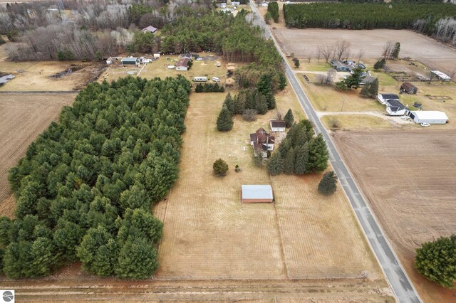 birds eye view of property featuring a rural view