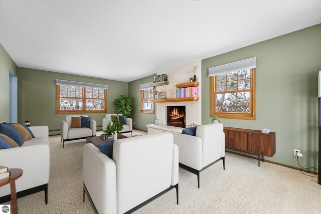 800 Evart St, Cadillac, MI 49601 - living room featuring baseboards, carpet, a brick fireplace, and baseboard heating