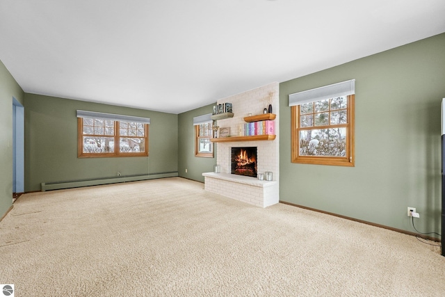 800 Evart St, Cadillac, MI 49601 - unfurnished living room featuring carpet flooring, baseboards, a baseboard heating unit, and a brick fireplace