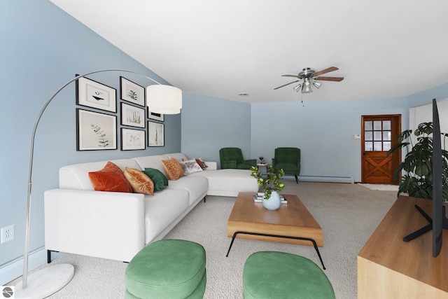 800 Evart St, Cadillac, MI 49601 - living room featuring a baseboard radiator, ceiling fan, and carpet flooring