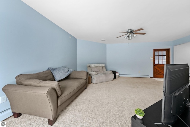 800 Evart St, Cadillac, MI 49601 - carpeted living area featuring baseboards, baseboard heating, and a ceiling fan