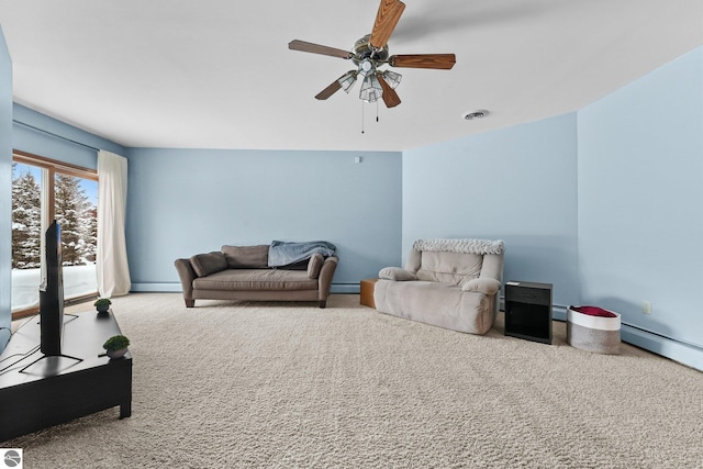 800 Evart St, Cadillac, MI 49601 - carpeted living area with ceiling fan, visible vents, and baseboard heating