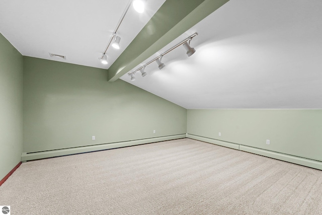 800 Evart St, Cadillac, MI 49601 - bonus room with carpet flooring, visible vents, baseboards, a baseboard radiator, and vaulted ceiling