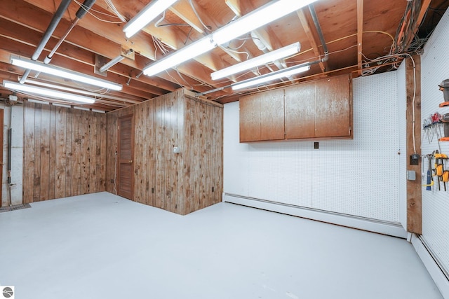 800 Evart St, Cadillac, MI 49601 - unfinished basement with a baseboard radiator and wood walls