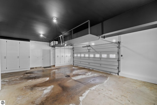 800 Evart St, Cadillac, MI 49601 - garage featuring a garage door opener