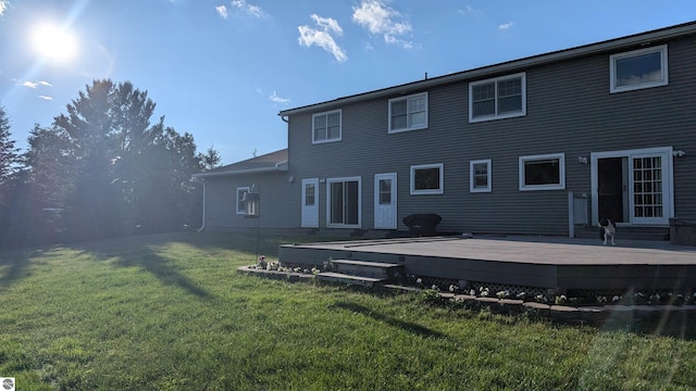 800 Evart St, Cadillac, MI 49601 - rear view of property featuring a lawn and a wooden deck