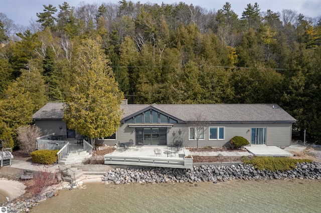 1137 Crystal Dr, Frankfort, MI 49635 - back of property featuring a wooden deck and a view of trees