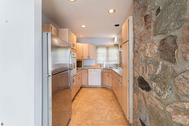 1137 Crystal Dr, Frankfort, MI 49635 - kitchen featuring light brown cabinets, a sink, white appliances, and recessed lighting