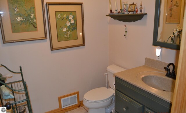 102 James Sq, Roscommon, MI 48653 - bathroom with toilet and vanity