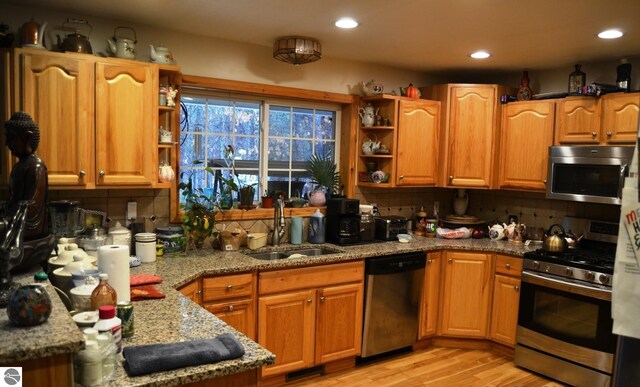 102 James Sq, Roscommon, MI 48653 - kitchen featuring appliances with stainless steel finishes, open shelves, a sink, decorative backsplash, and recessed lighting