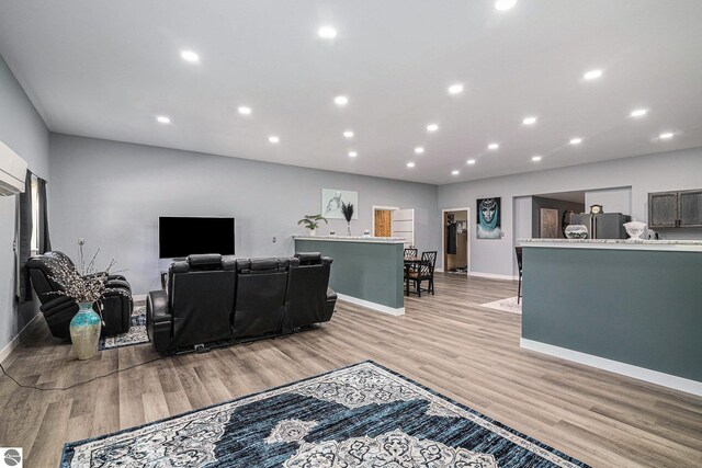9809 Wilson Rd, Buckley, MI 49620 - living area with baseboards, light wood-style floors, and recessed lighting