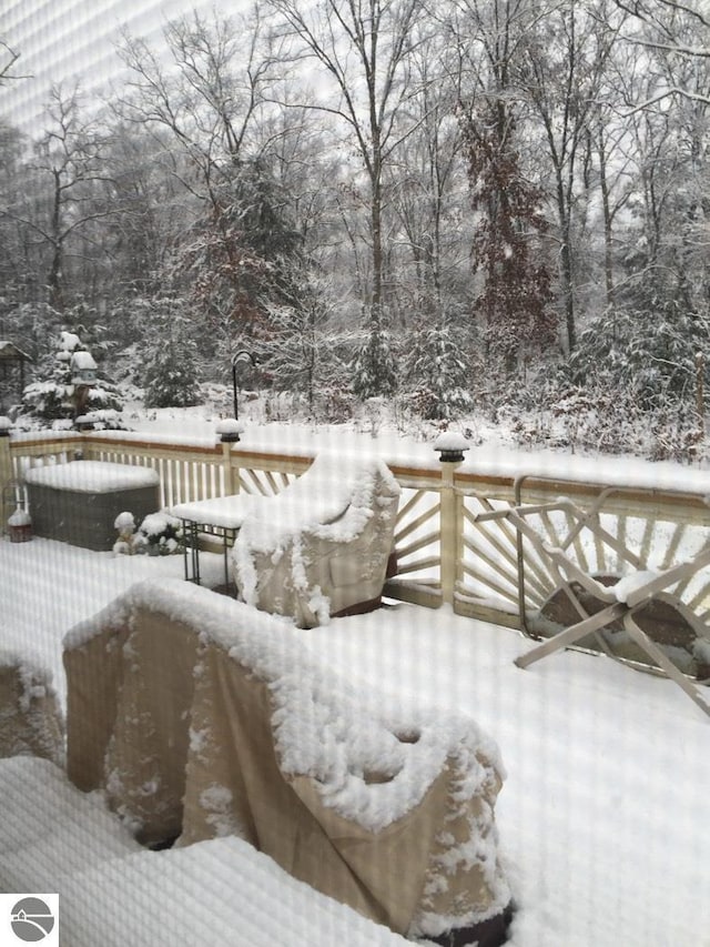 view of snow covered deck