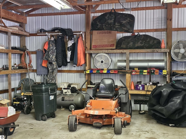 garage with metal wall and electric panel