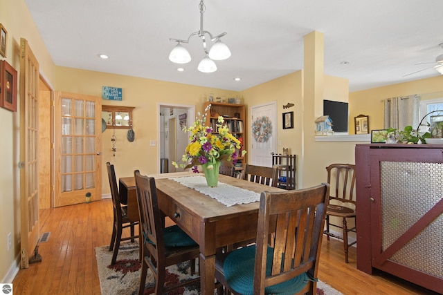 112 N Benzie Blvd, Beulah, MI 49617 - dining room with recessed lighting, hardwood / wood-style flooring, a chandelier, and visible vents