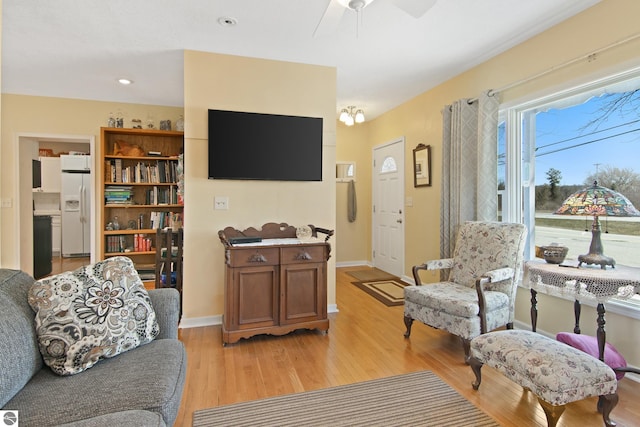 112 N Benzie Blvd, Beulah, MI 49617 - living area featuring recessed lighting, baseboards, ceiling fan, and light wood-type flooring