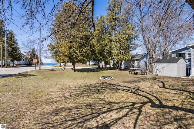 112 N Benzie Blvd, Beulah, MI 49617 - view of yard with an outdoor structure and a shed