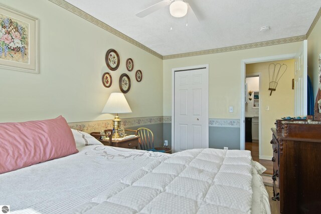 112 N Benzie Blvd, Beulah, MI 49617 - bedroom featuring ornamental molding and ceiling fan