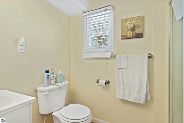 112 N Benzie Blvd, Beulah, MI 49617 - bathroom with toilet and vanity