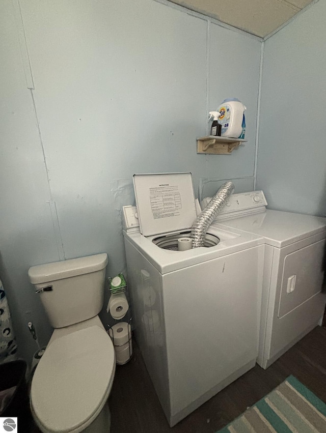 clothes washing area featuring washer and dryer and laundry area